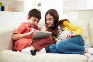 image of kids on sofa for Sydney residential upholstery cleaning service from Green Clean Carpet Cleaning